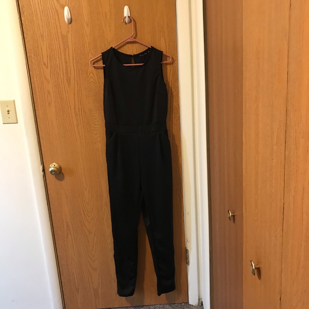 A black jumpsuit. NEVER worn - tags still on!